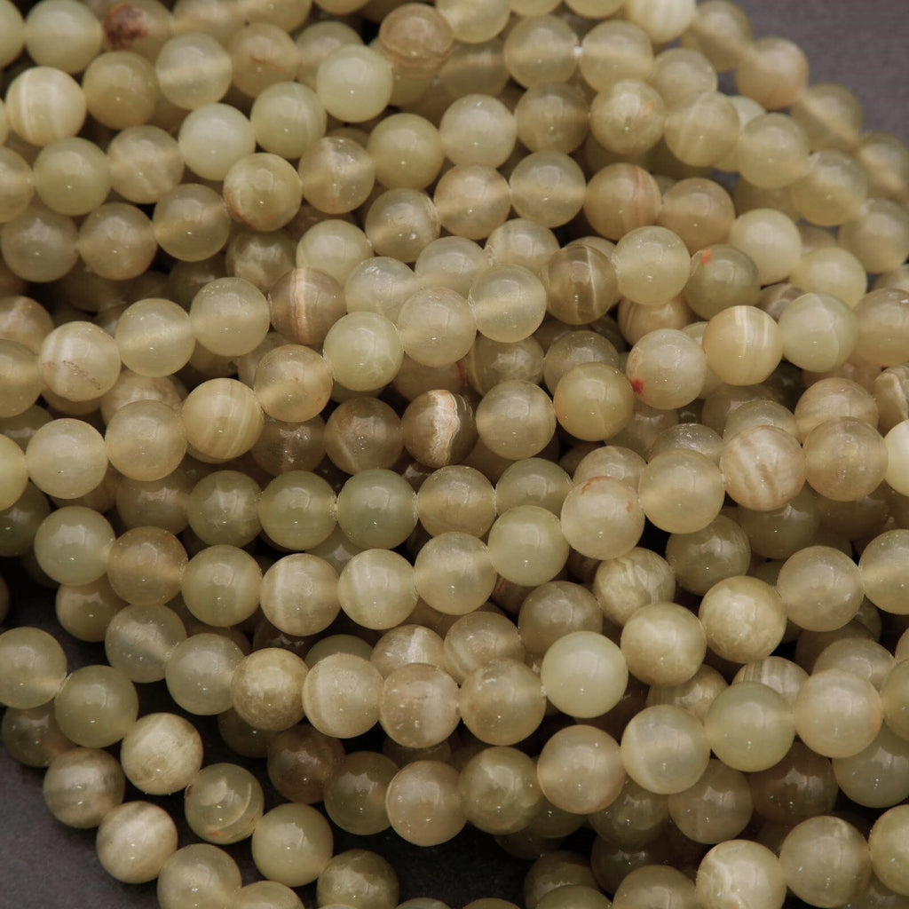 Close-up of a string of light-colored beads.