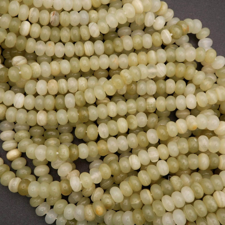 Close-up of light green beads on a dark background