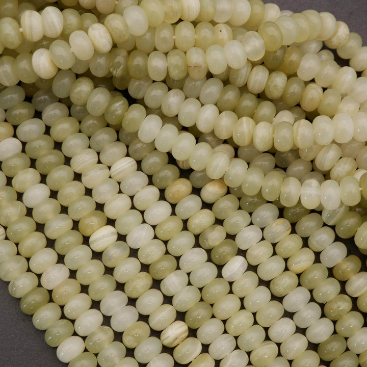 Close-up of light green beads on a dark background