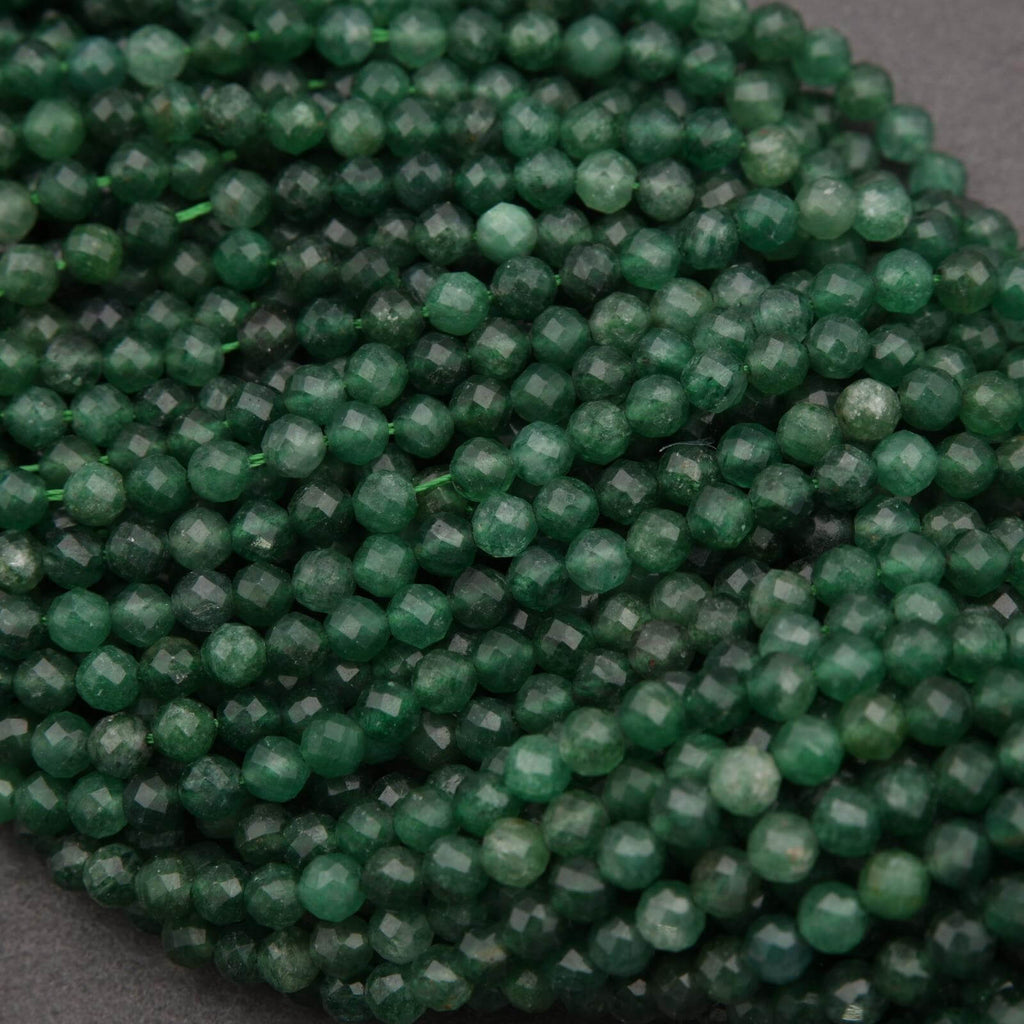 Close-up of green beads on a dark background