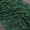 Close-up of green beads on a dark background