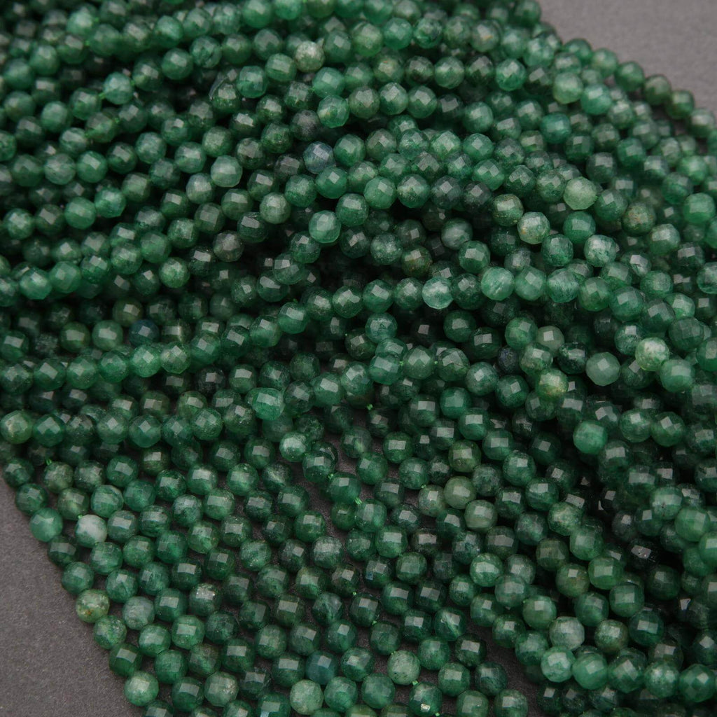 Close-up of green beads on a dark background