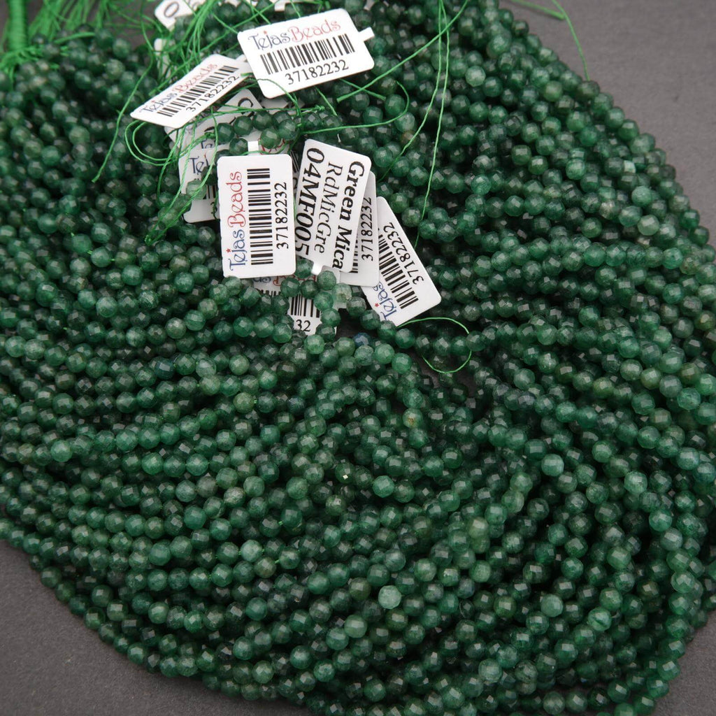 Green beads with price tags on a dark surface
