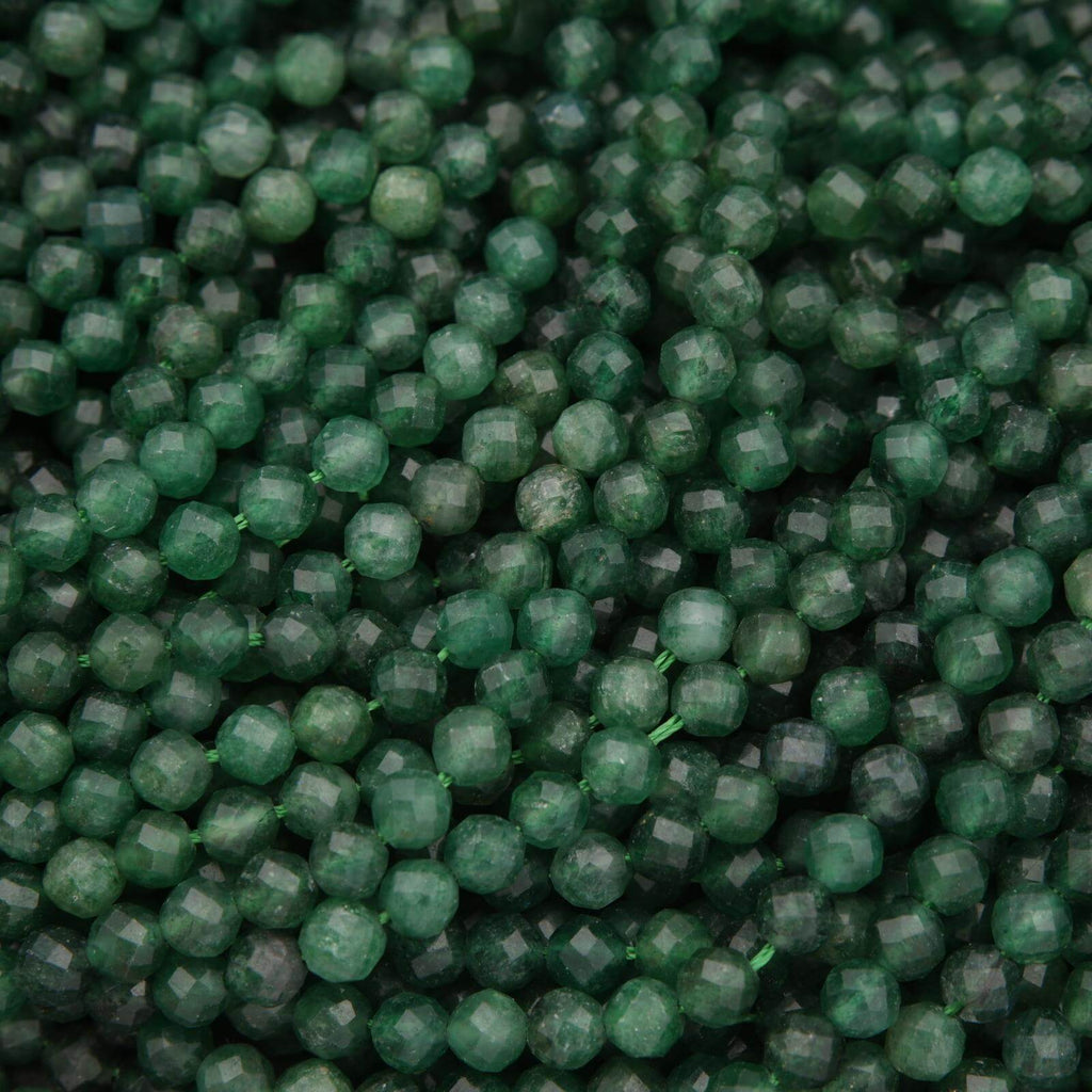 Close-up of green beads with a faceted surface