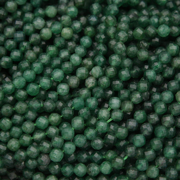 Close-up of green beads with a faceted surface