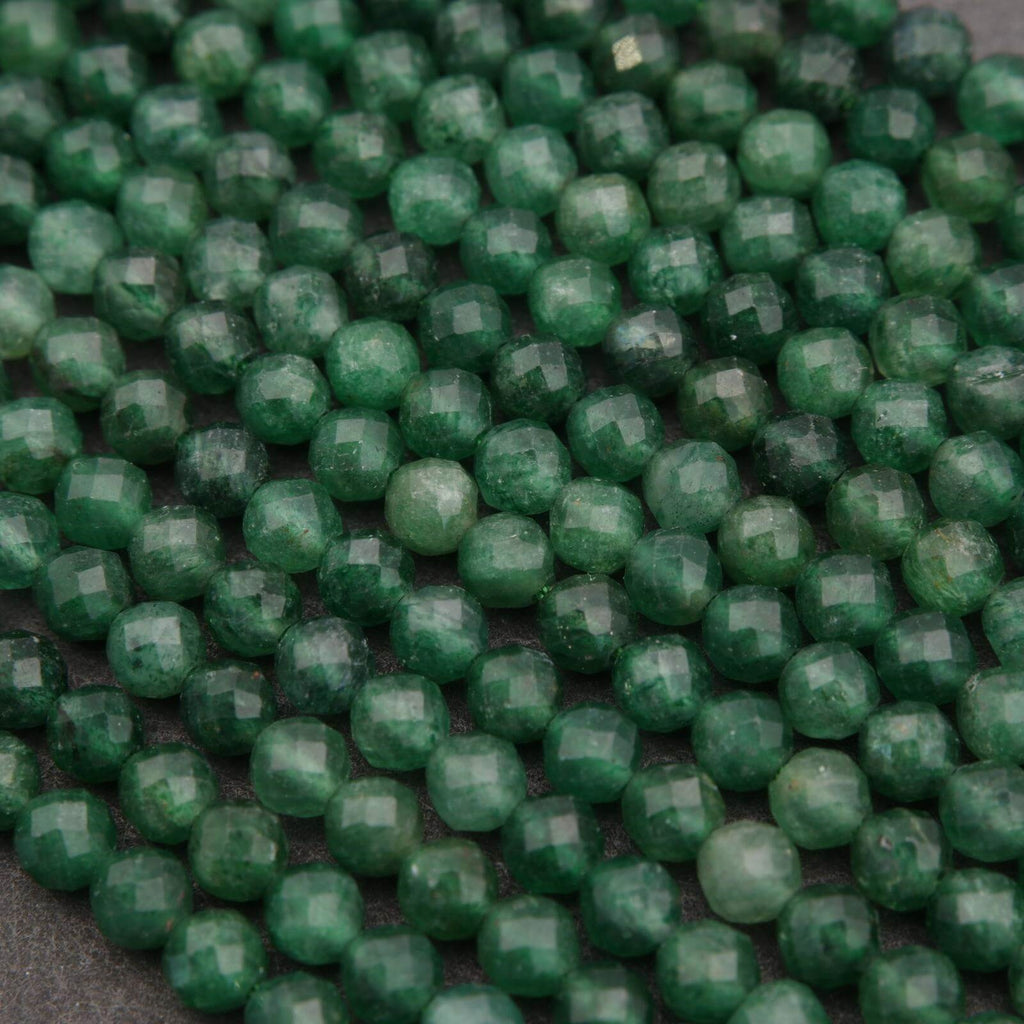 Close-up of green beads on a dark background