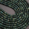 Close-up of green beads on a gray background