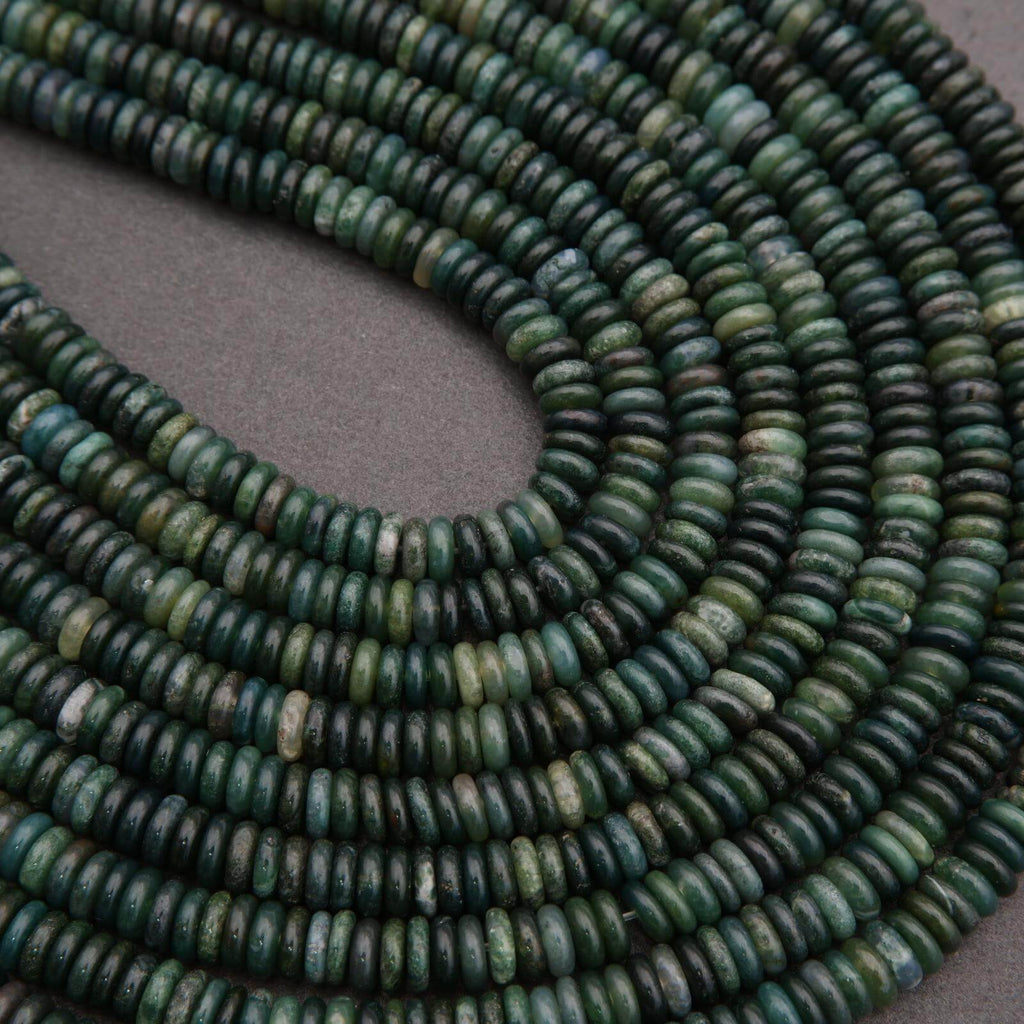 Close-up of green beads on a gray background