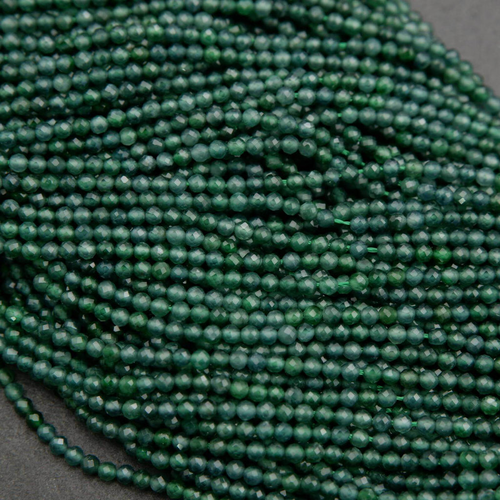 Tiny faceted green beads on a string.