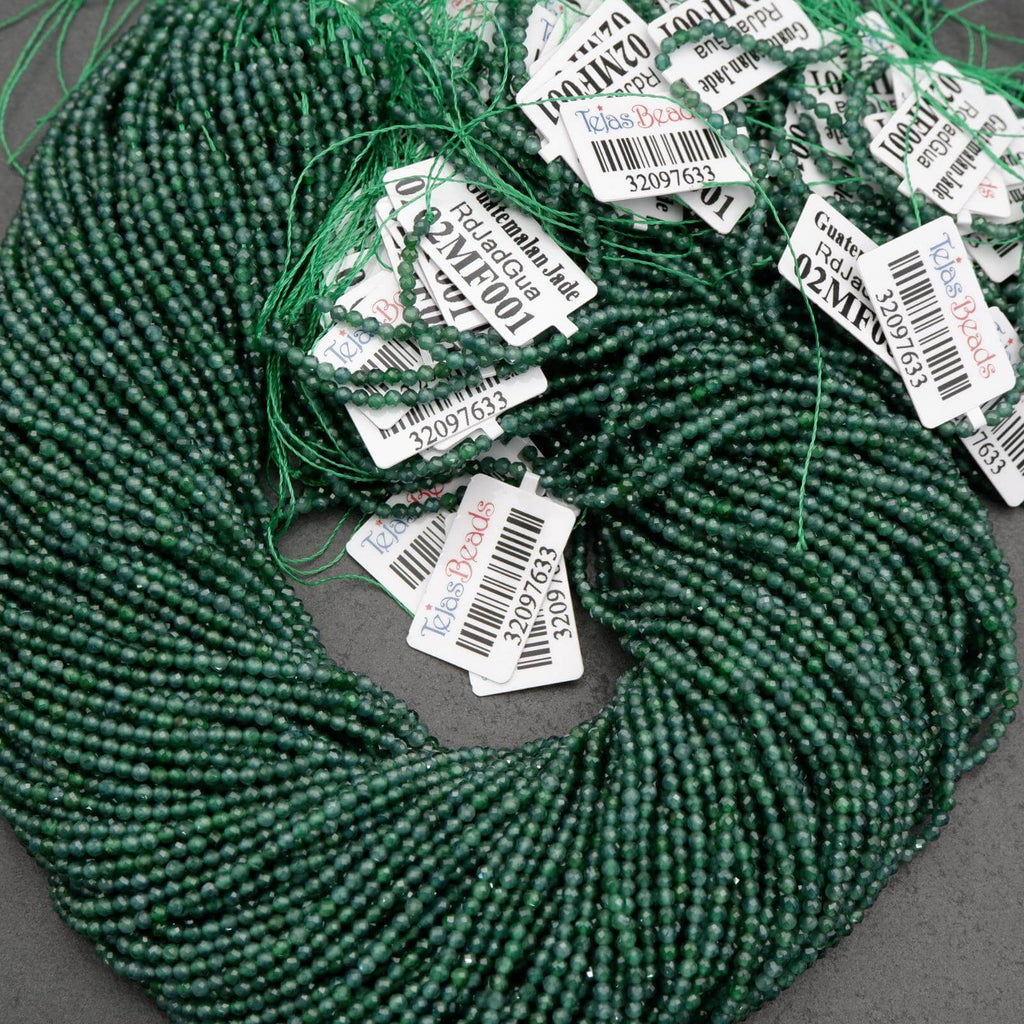 Tiny faceted green beads on a string.