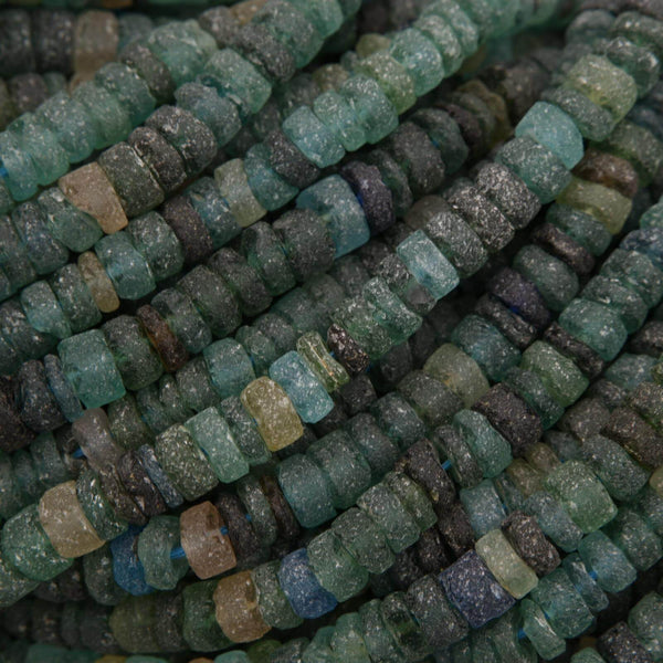 Close-up of green and brown beaded strands