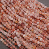 Close-up of pink and clear beads on a gray background