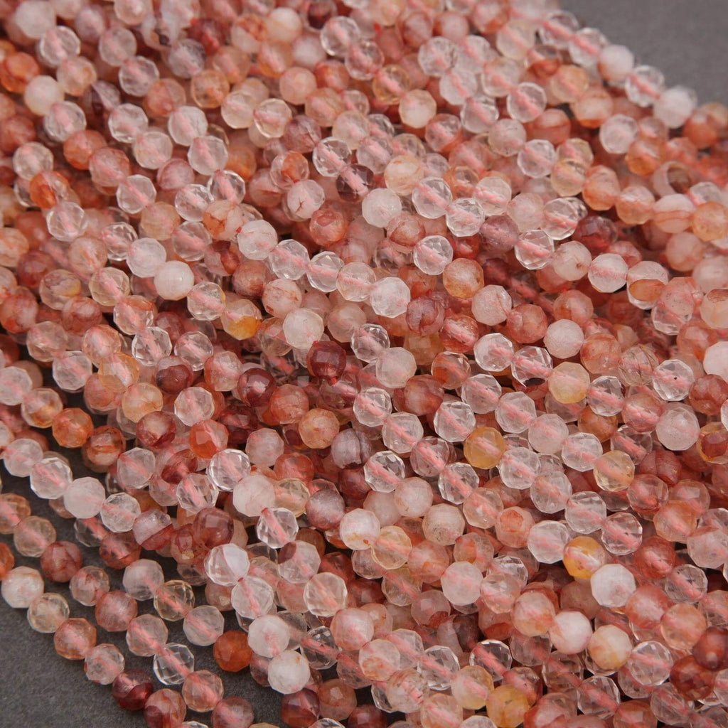 Close-up of pink and clear beads on a gray background