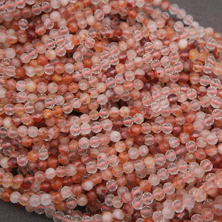 Close-up of pink and red beads on a dark background