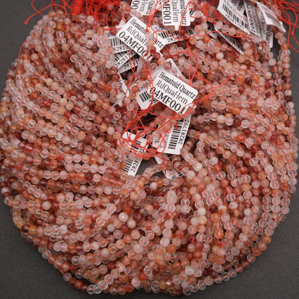 String of pink beads with labels on a dark background