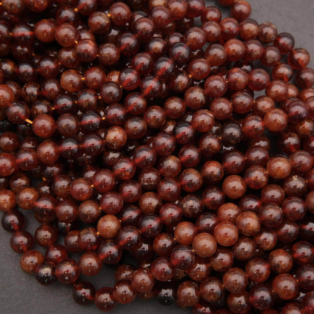 Close-up of dark brown beads on a gray background