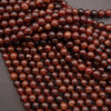 Close-up of a string of brown beads on a dark background
