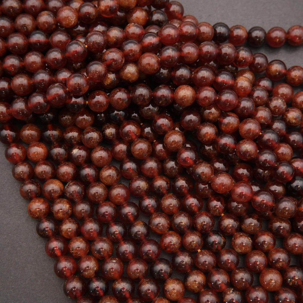 Close-up of a string of brown beads on a dark background