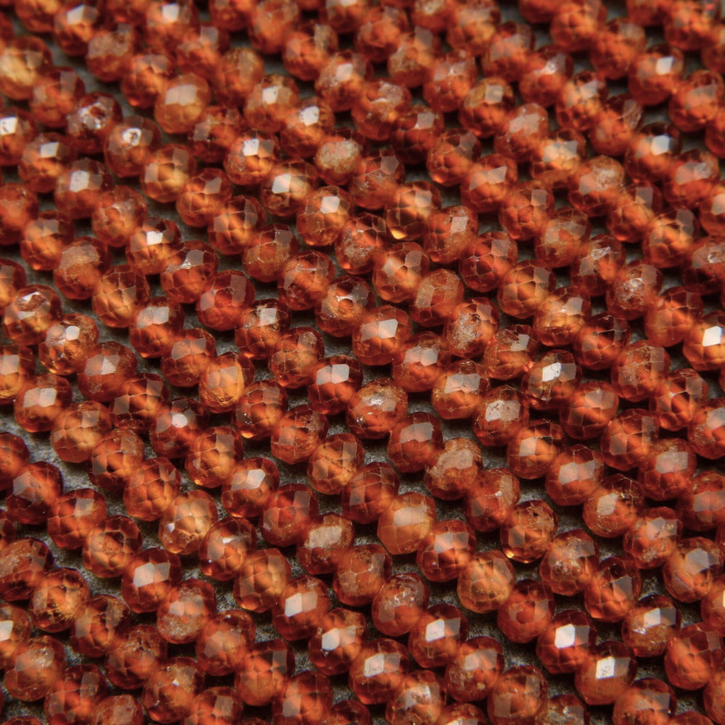 Orange hessonite garnet beads.
