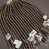 Brown hair extensions with barcodes on a gray background