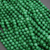Close-up of green beads on a dark background