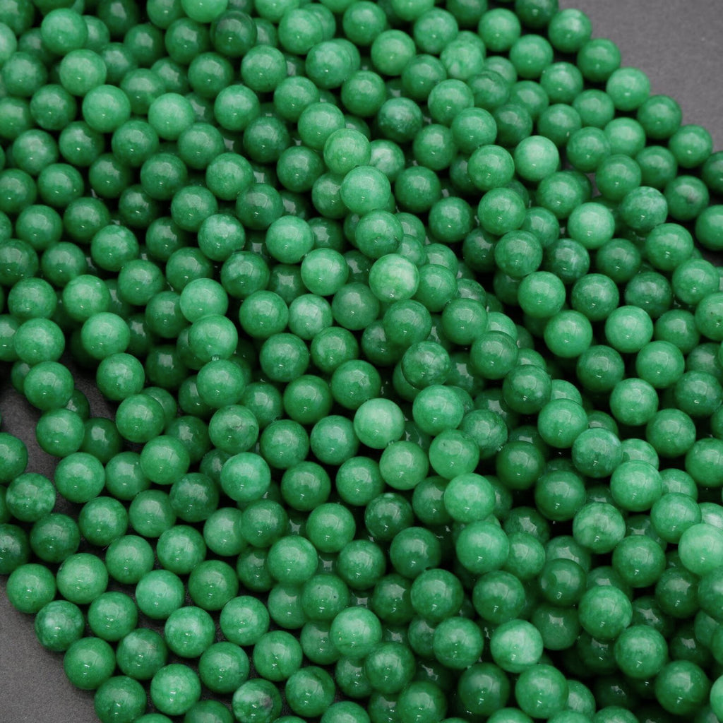 Close-up of green beads on a dark background