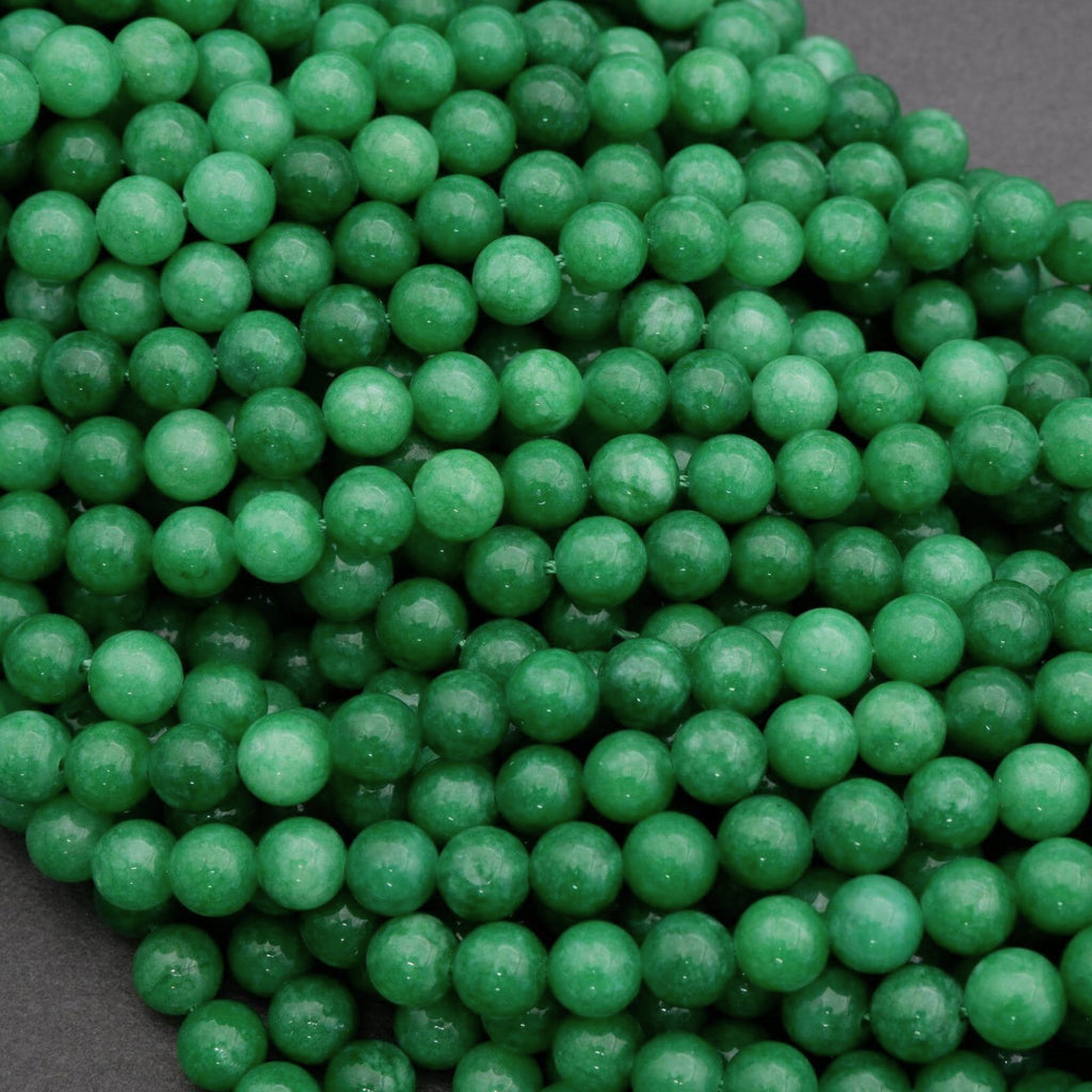 Close-up of green beads on a dark background