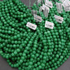 Green beads with barcodes on a gray background