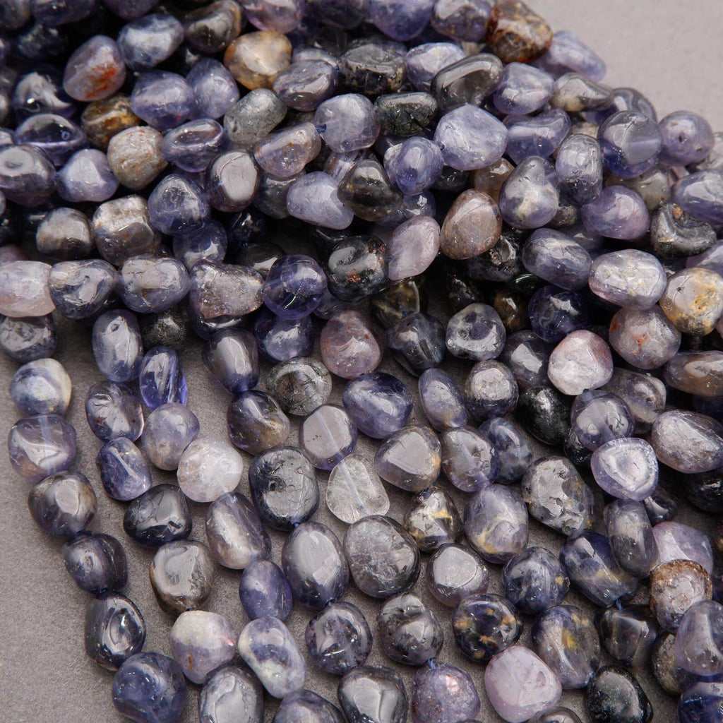 Close-up of small, multicolored pebbles on a neutral background