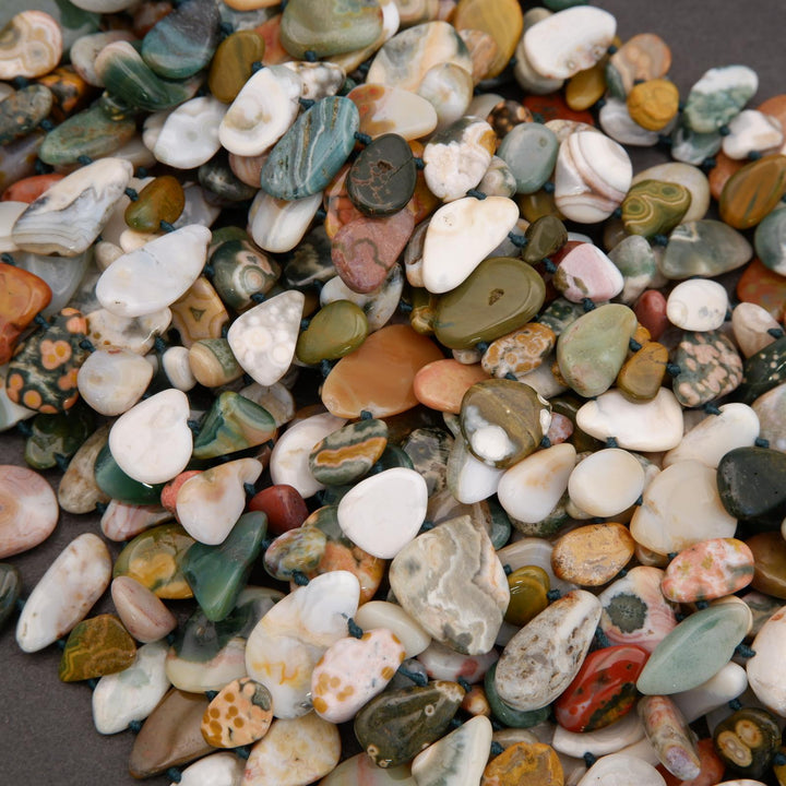 Close-up of multicolored pebbles on a dark surface