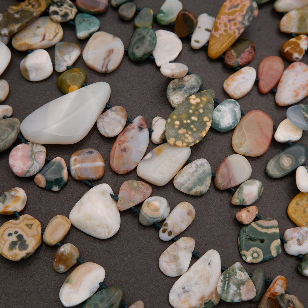 Assorted multicolored stones on a dark surface