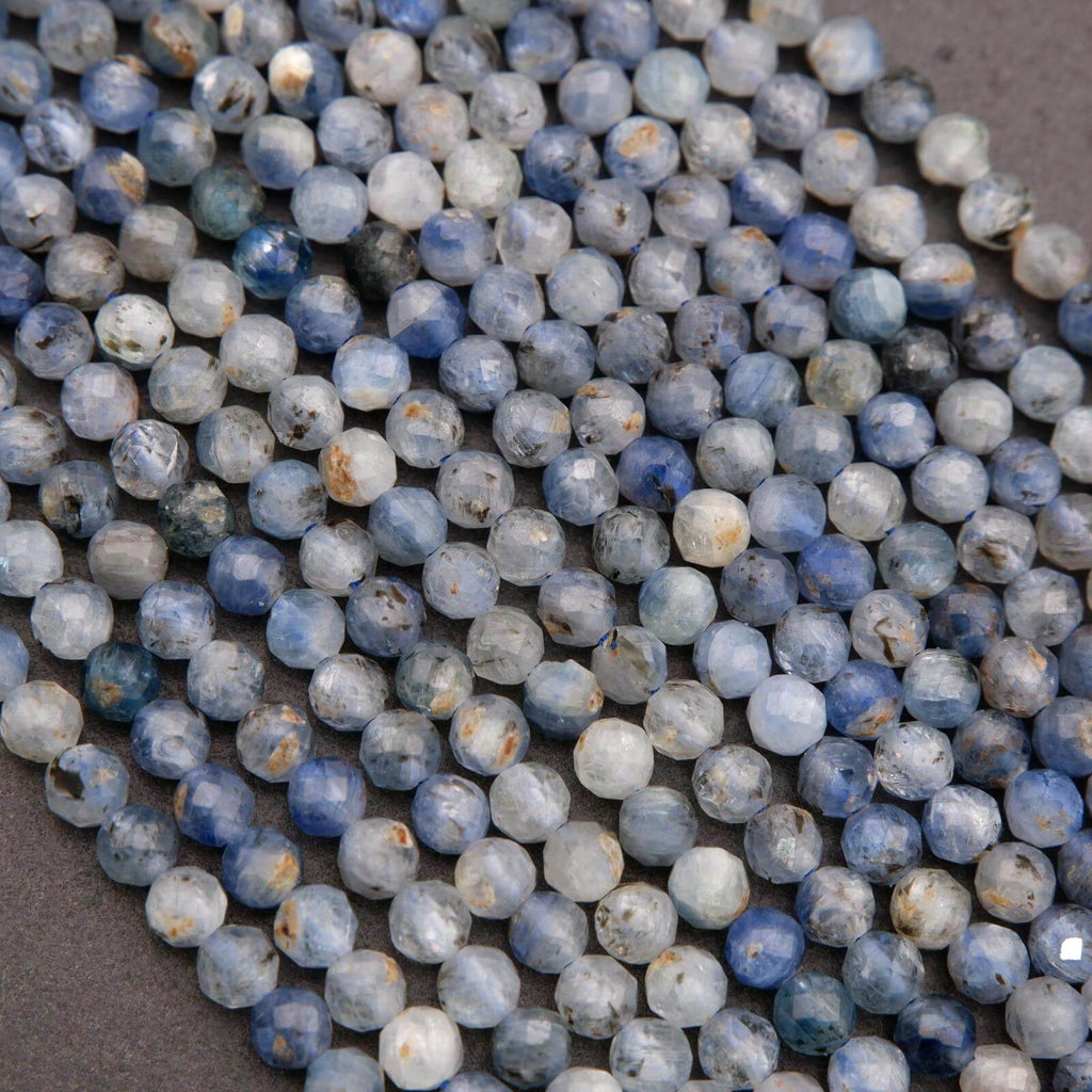Light blue and gray kyanite faceted beads with natural inclusions and subtle shimmer.