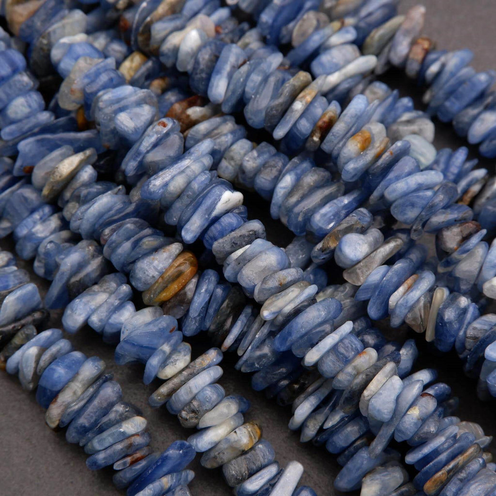 Close-up of blue stone beads on a dark background
