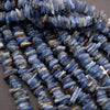 Close-up of blue stone beads on a gray surface