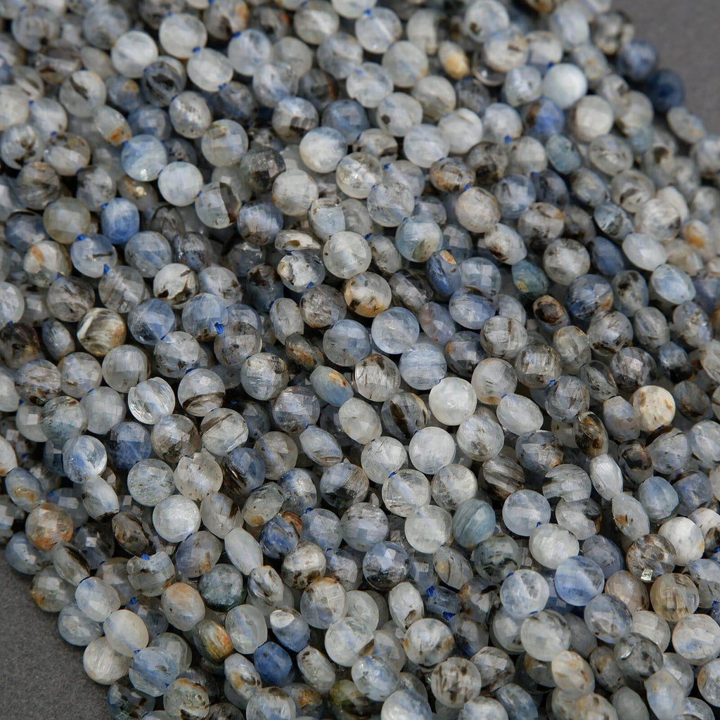 Close-up of small, multicolored beads on a gray surface