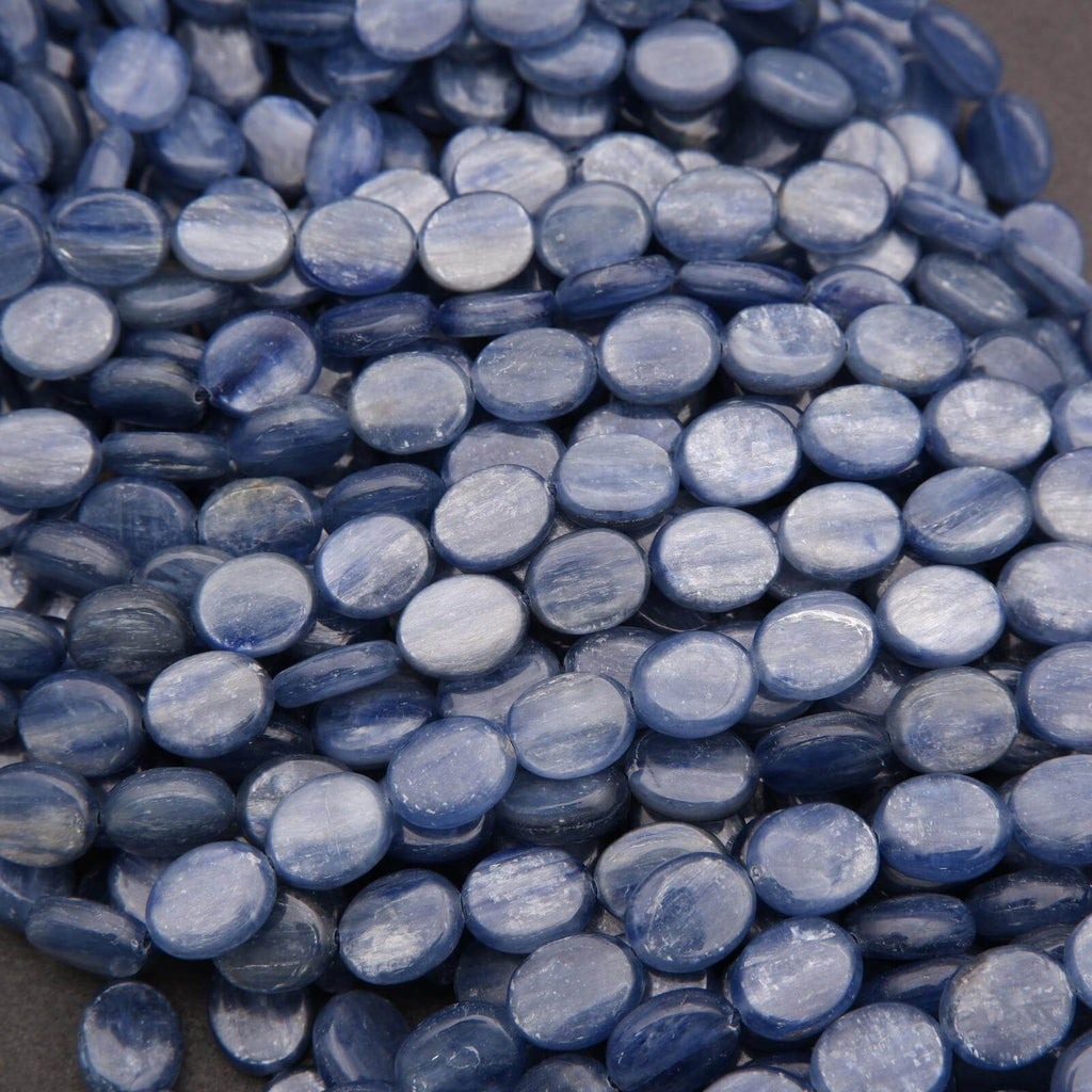 Close-up of blue marbled beads on a gray background