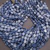 String of blue oval beads on a gray background