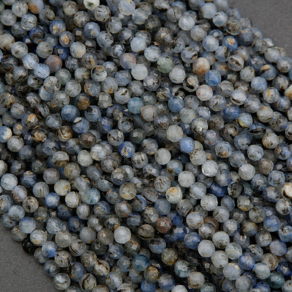 Faceted kyanite beads showing organic inclusions