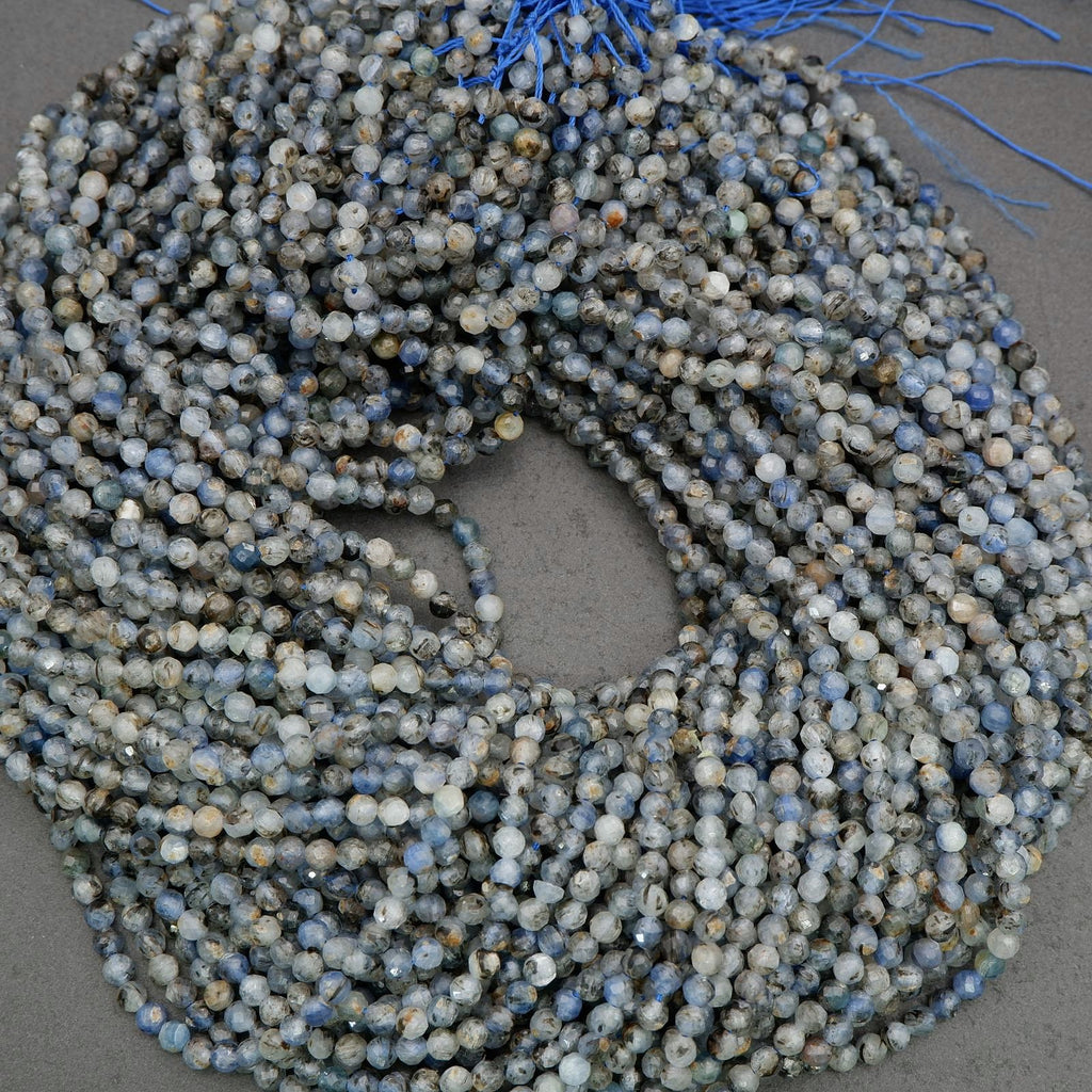 Faceted kyanite beads with mixed blue and smoky hues