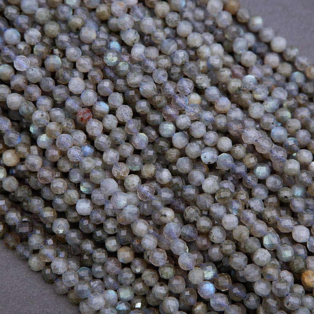 Close-up of small, round, multicolored beads on a neutral background