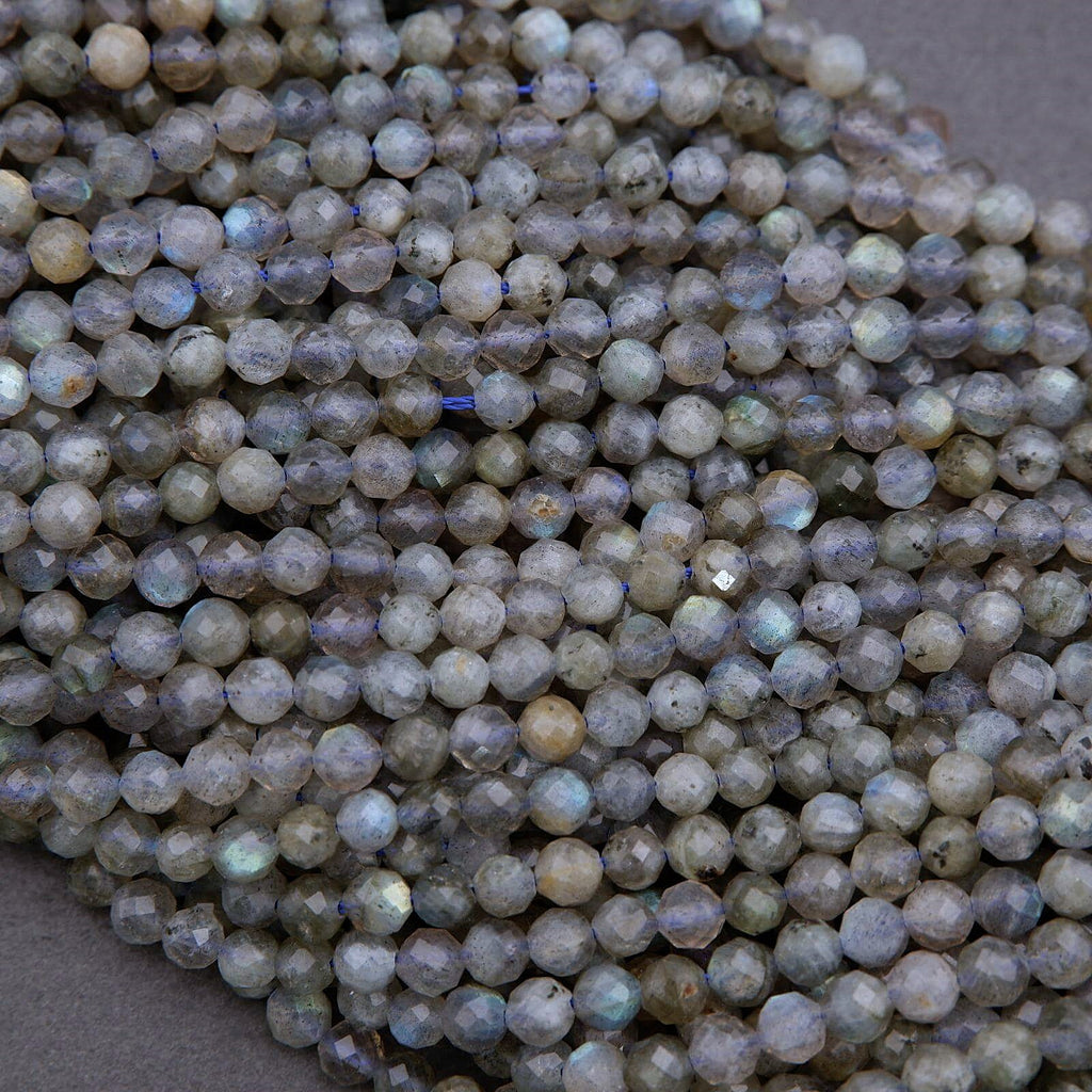 Close-up of light blue faceted beads on a gray background