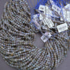 String of beads with price tags on a neutral background