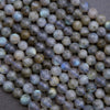 Close-up of faceted gemstones on a textured surface