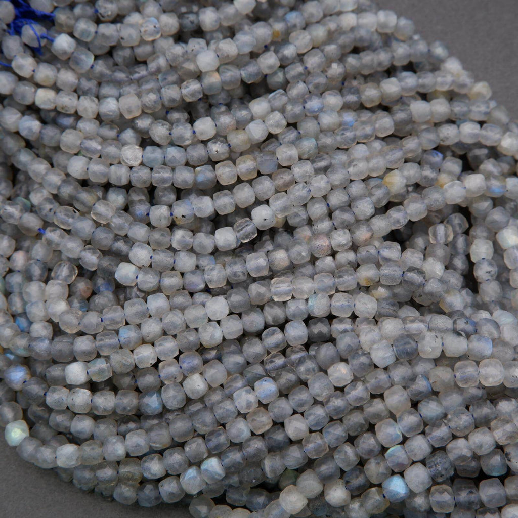 Close-up of a string of small, round, gray beads.