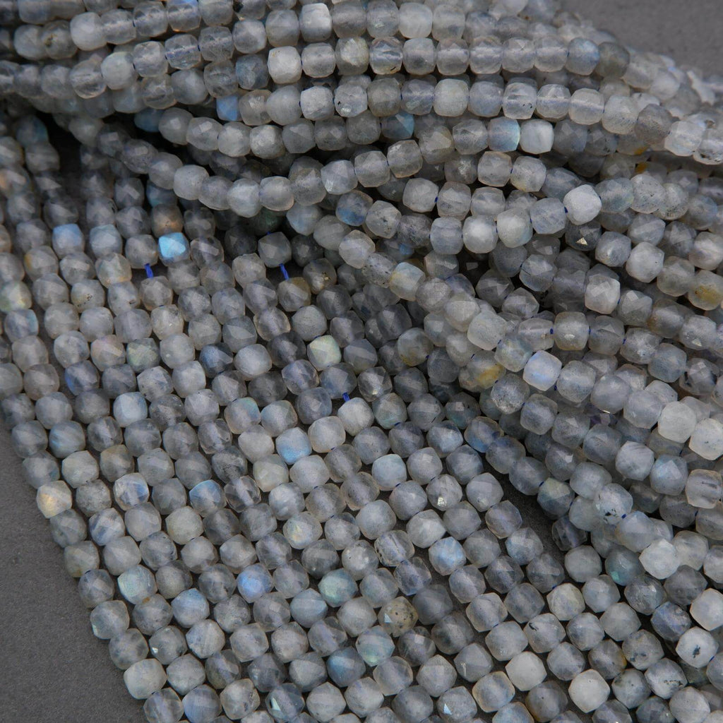 Close-up of light blue beads on a gray background