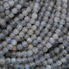 Close-up of gray beads with a textured surface