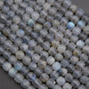 Close-up of faceted blue gemstones on a dark background