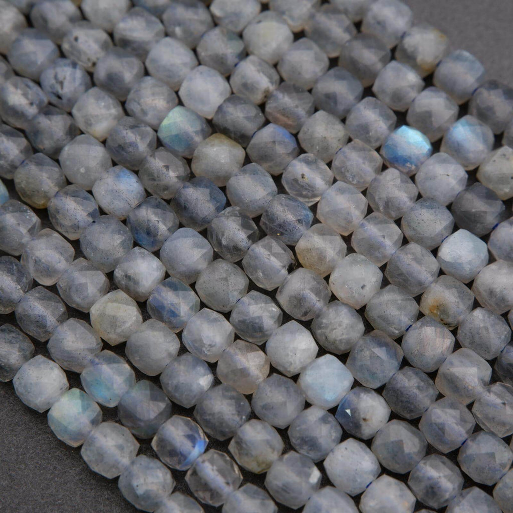 Close-up of faceted blue gemstones on a dark background