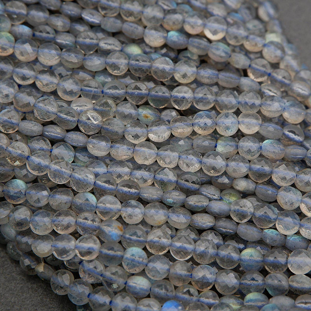 Close-up of blue iridescent beads on a dark background
