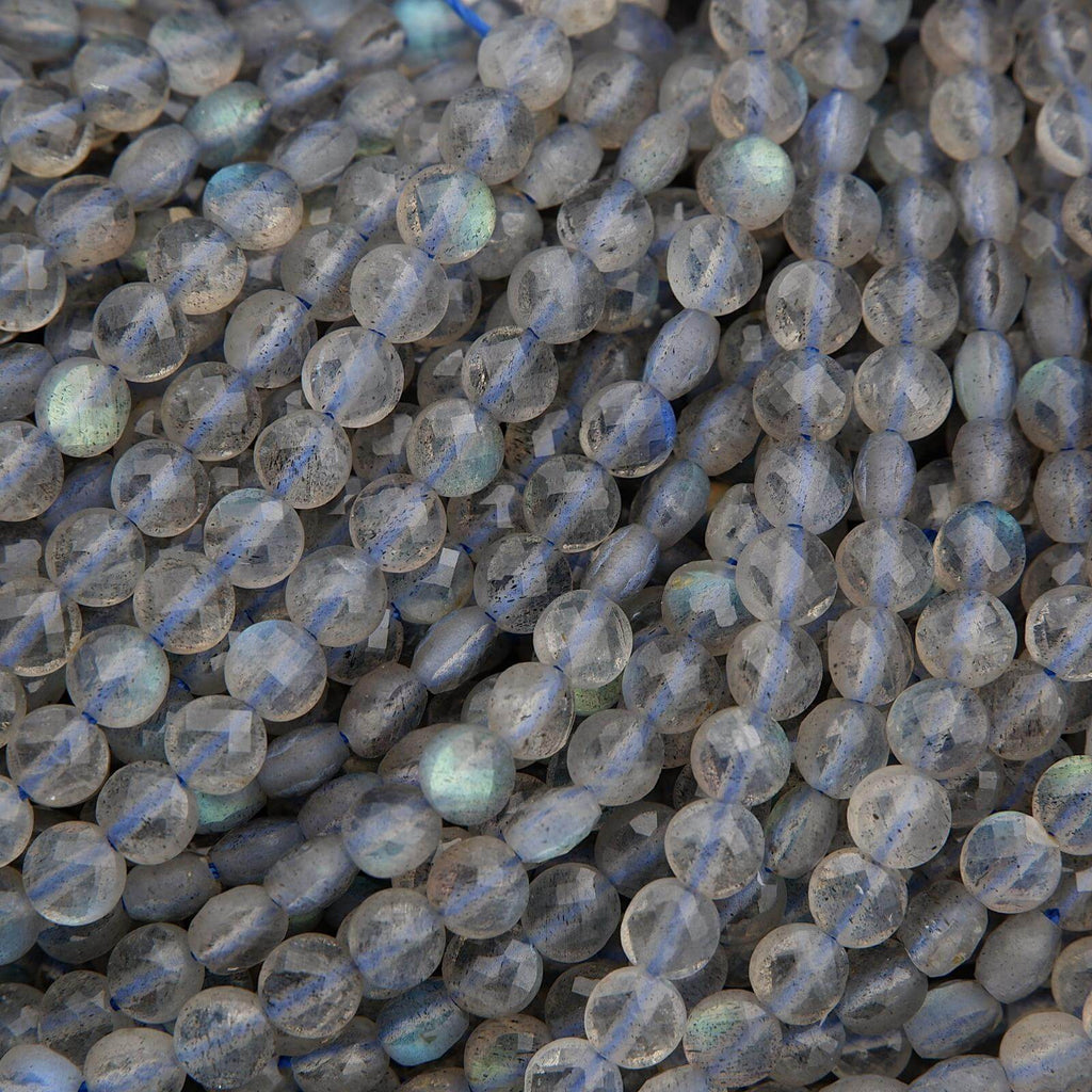 Close-up of translucent beads with blue and green reflections